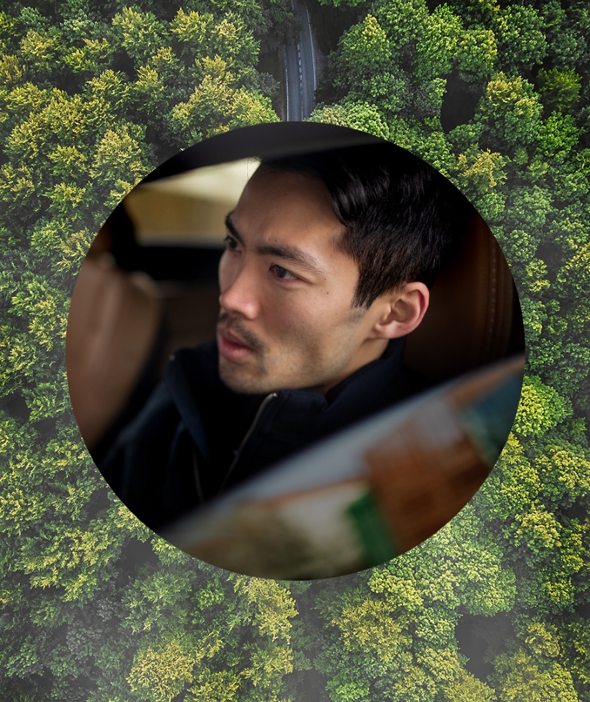 Man driving in forest